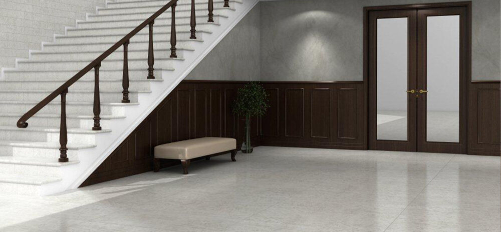 Carrelage Zuccherino 60x120 lappato blanc avec points colorés rappelant l’arc-en-ciel.